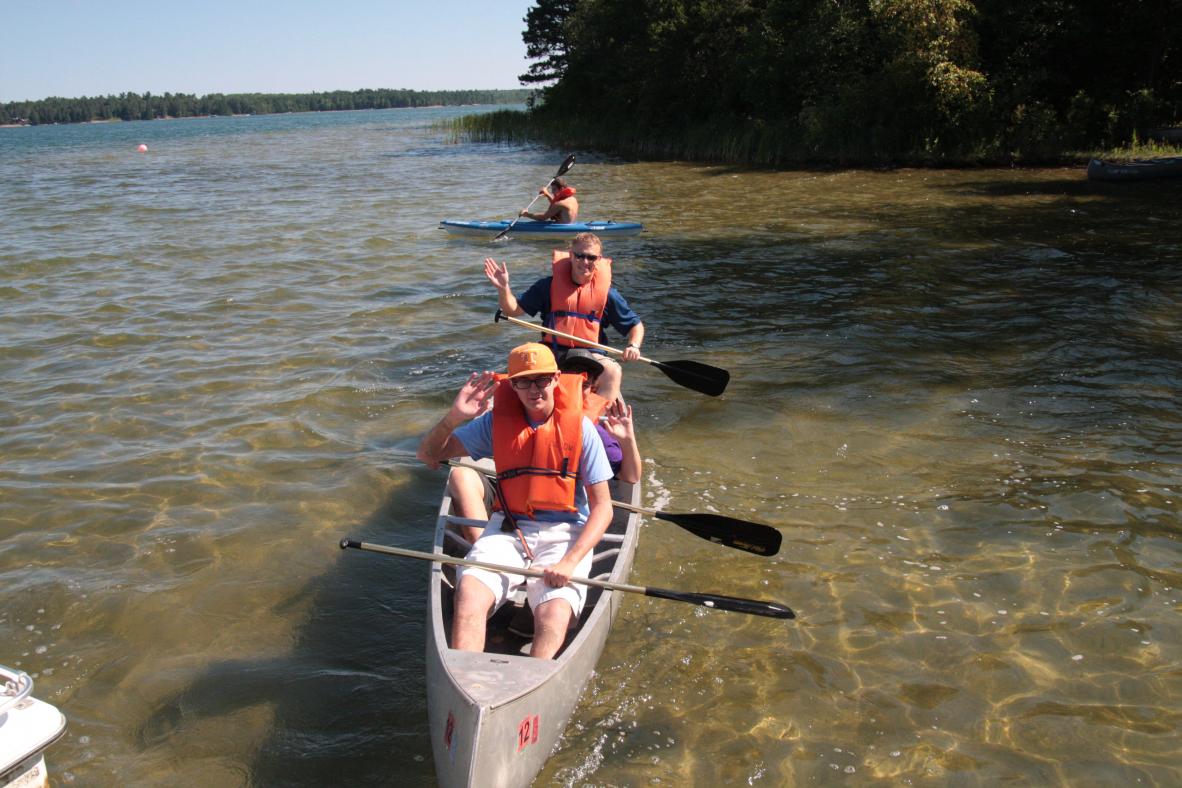Campers canoeing in the lake.