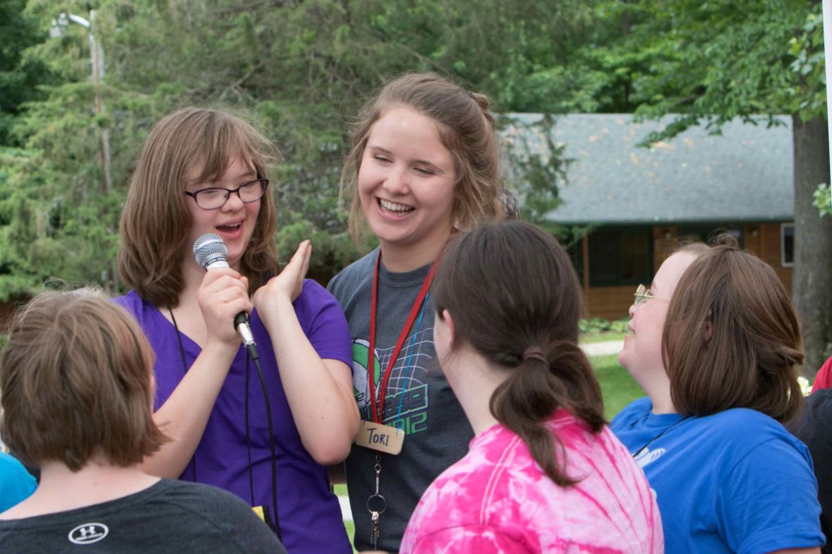 Campers singing along with each other.