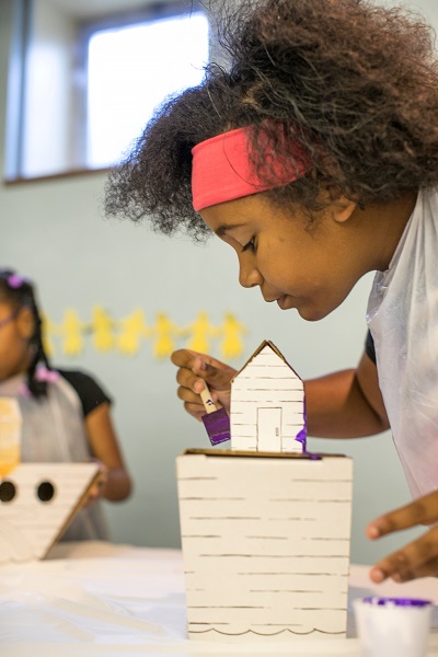 Girl painting Noah's Ark craft