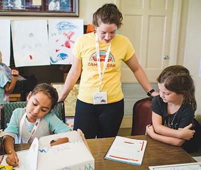Volunteer with two girls