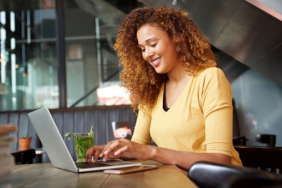 woman typing on computer