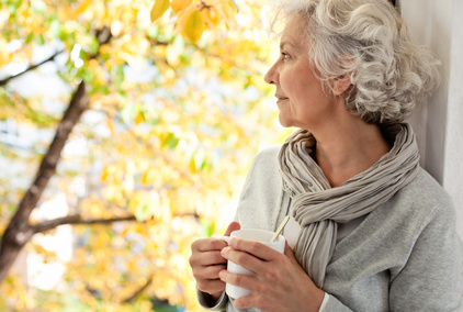 Woman looking out of window.