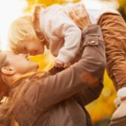 mom lifting child into the air