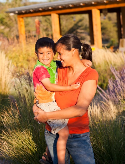 Mom holding her child in a field of lavender
