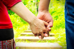 Couple holding hands
