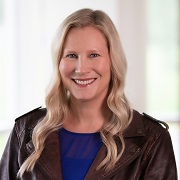 A person smiling at camera

Description automatically generated
