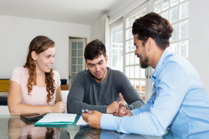 Couple working with professional on home costs