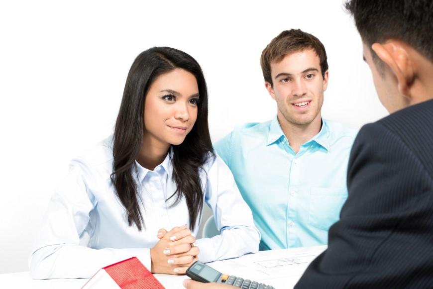 Multiracial couple meeting with financial advisor