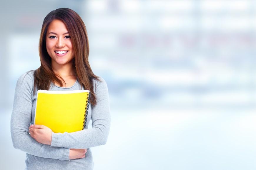 Female student holding notebook
