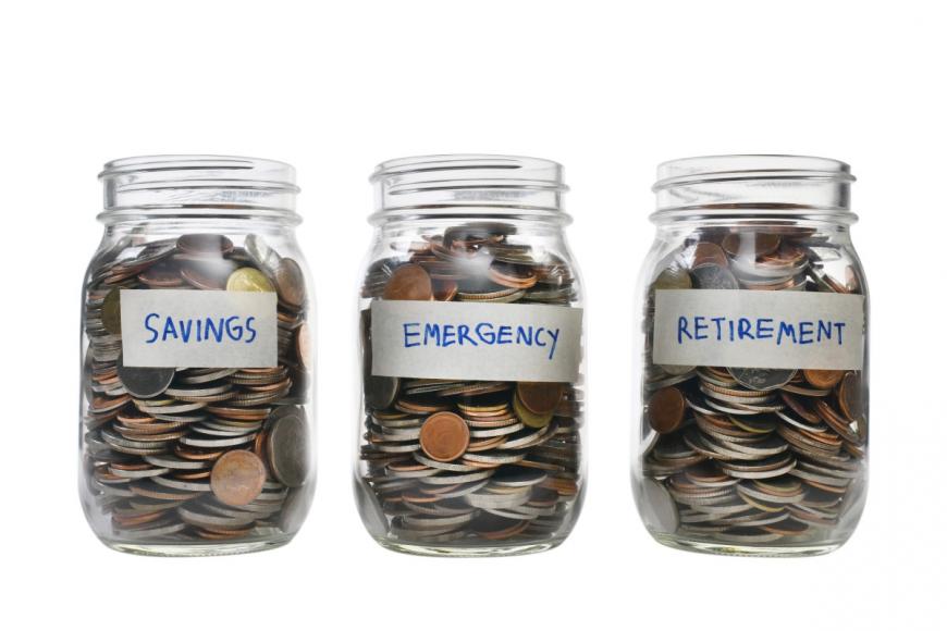 Three jars filled with coins. First labled Savings, Second labeled Emergency, Third labled Retirement