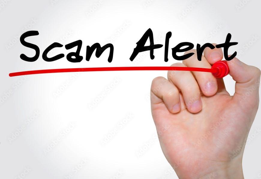 Hand writing words, Scam Alert