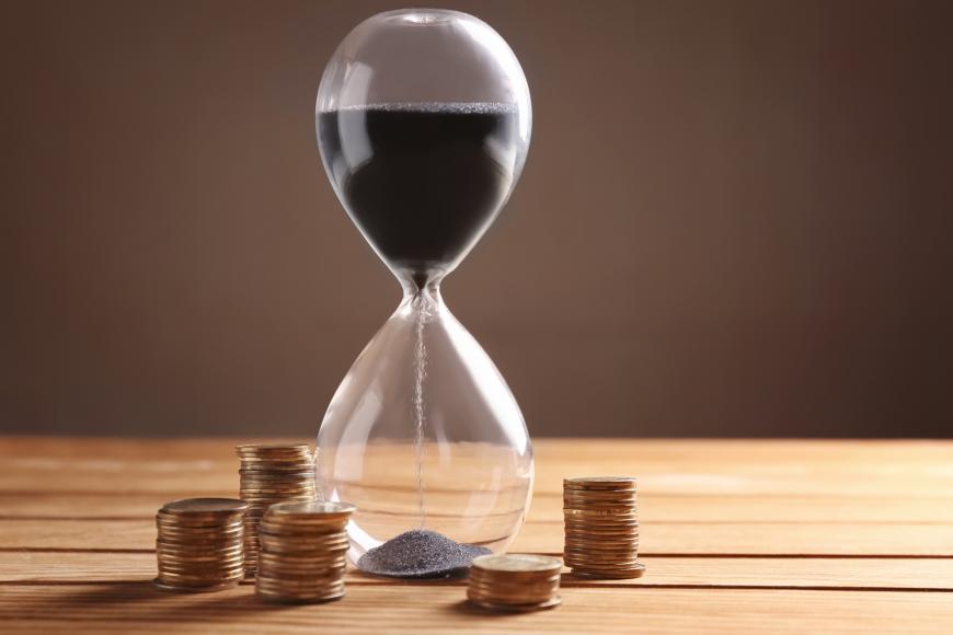 Hour glass with coin change around it