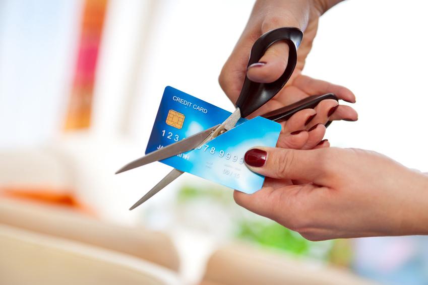 Person cutting up credit card