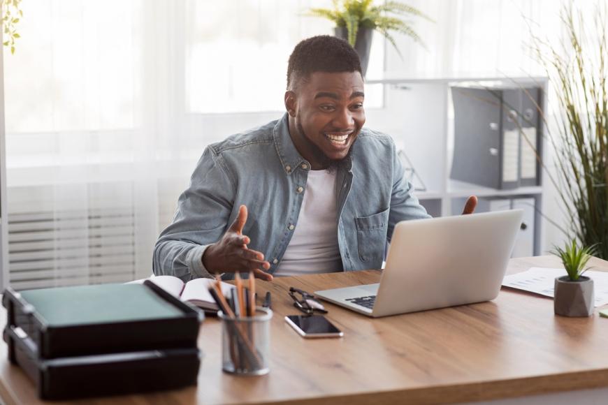 Happy man at computer