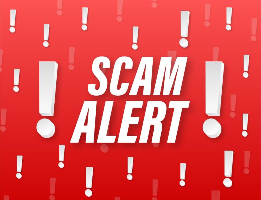 The words "Scam Alert" surrounded by exclamation points on a red background