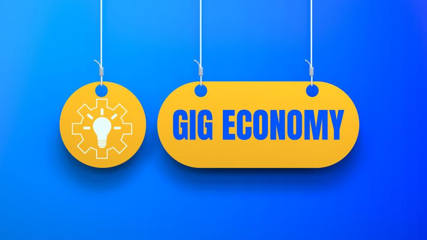 Graphic of light bulb embedded inside a gear. To the right of the graphic reads, "Gig Economy."
