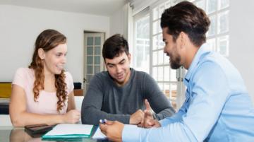 Couple working with professional on home costs