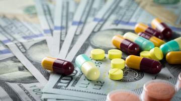 Pills on top of $100 bills