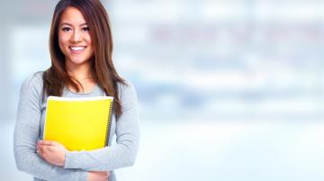 Female student holding notebook