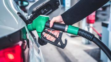 Woman pumping gas