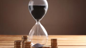 Hour glass with coin change around it