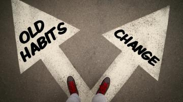 Two arrows pointing in different directions.  One says "Old Habits," and the other says "Change."