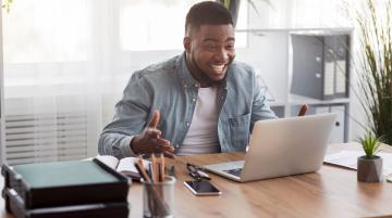 Happy man at computer