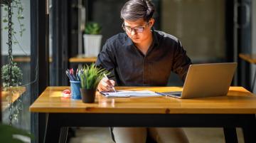 Asian man on laptop