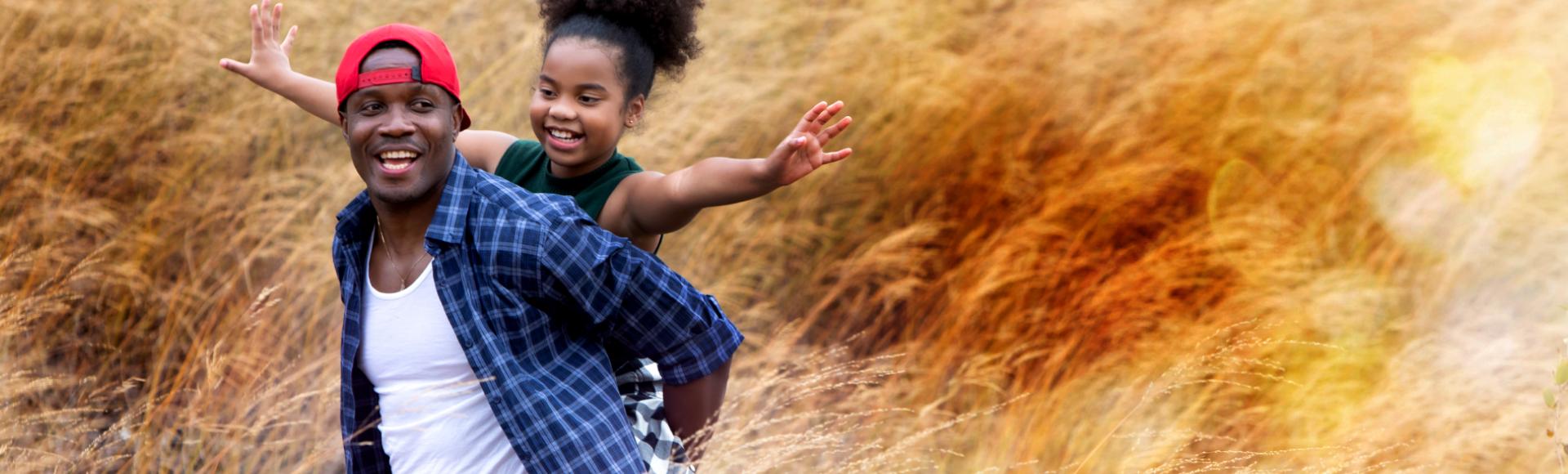 Photo of man and girl in a field