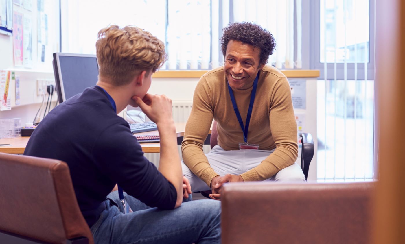 Counselor speaking with a student