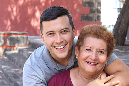 Young man embracing his mother