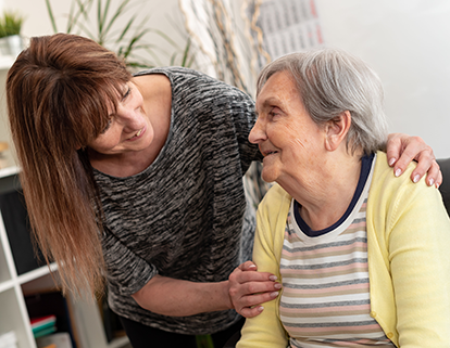 Elderly woman with her caretaker
