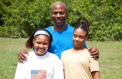 photo of dad and daughters