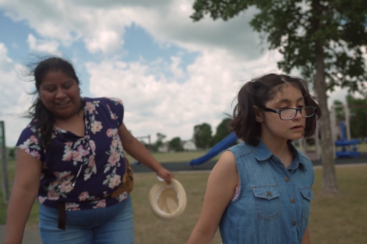 Zuleyka (right) plays at her neighborhood park with Lucia Hernandez Sanchez, her caregiver. Photo courtesy PICS.