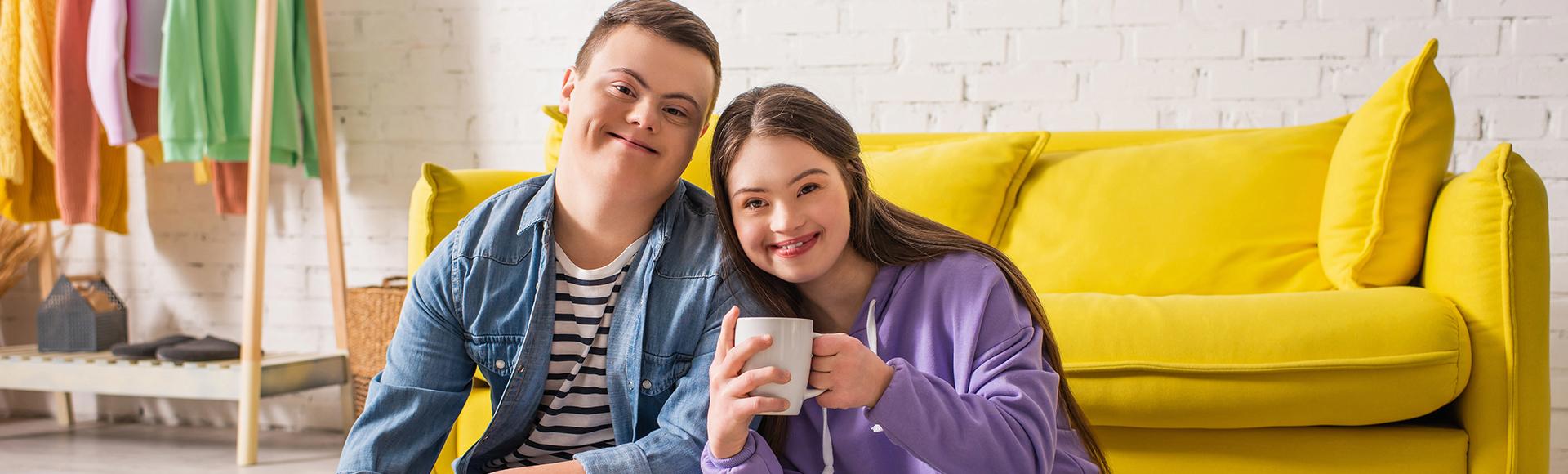 Two individuals smiling