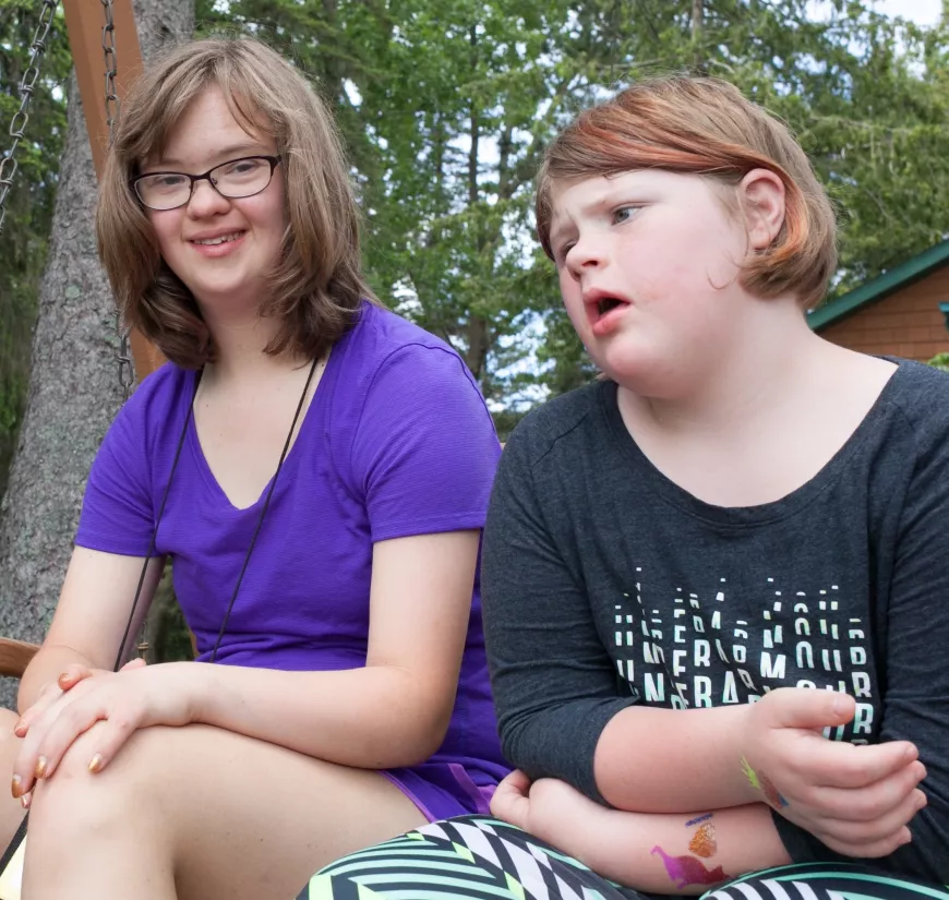 Campers sitting outside.