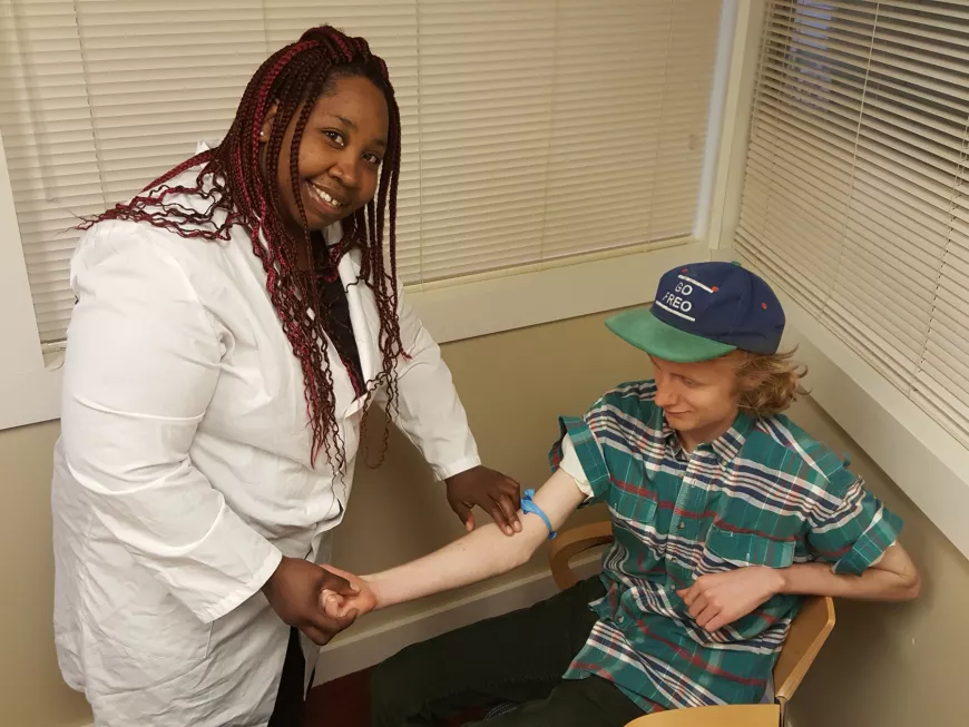 Medical professional helping a patient.