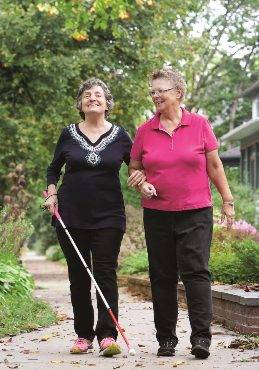 Older adults walking outside.
