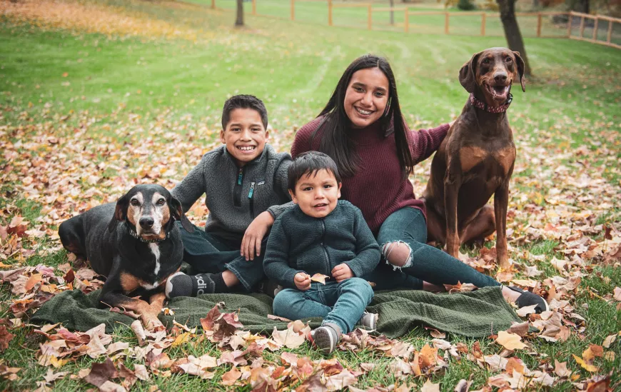 A family sitting together outside