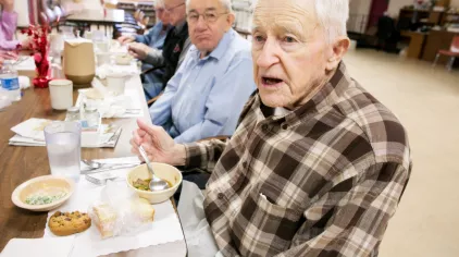 Dallas eating lunch with others.
