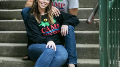 Ally sitting in a stairway.