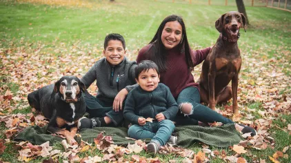 A family sitting together outside