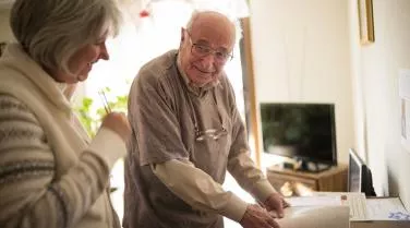 Older man adn women at desk